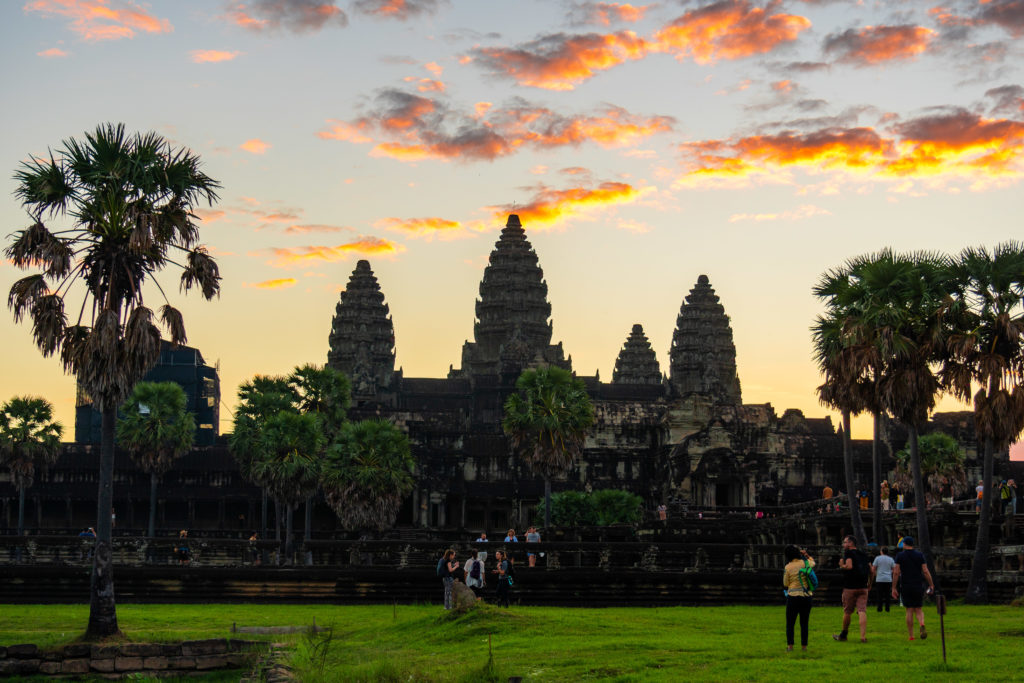Angkor Wat temple silhouetted against a coloured sunset sky in Cambodia