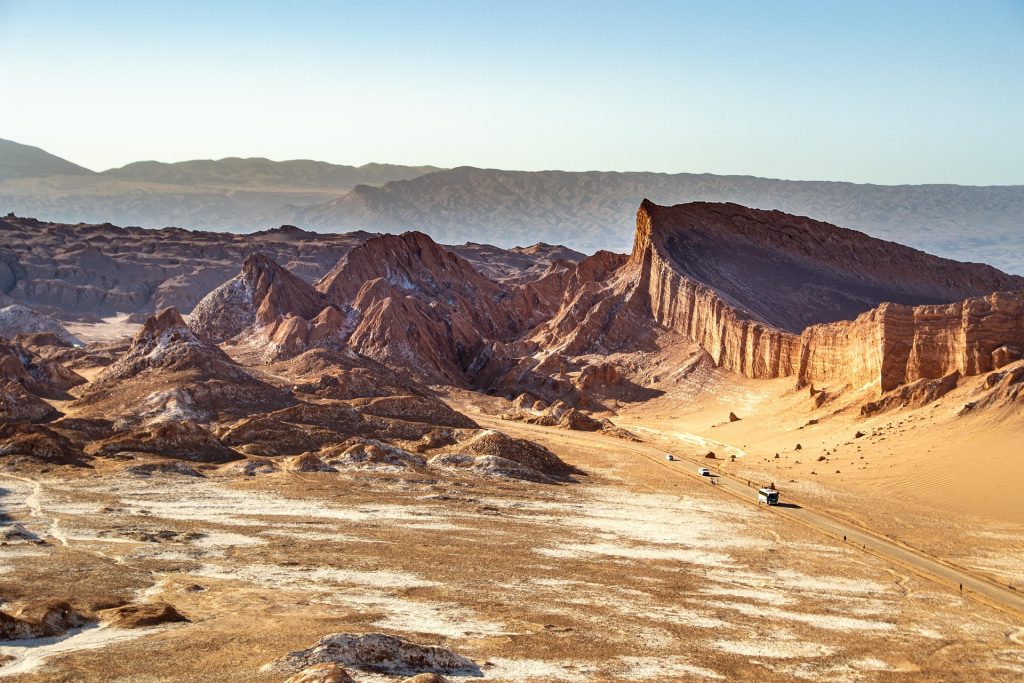 Dramatic desert rock formations overlooking a vast arid valley