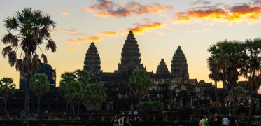 Angkor Wat temple silhouetted against a coloured sunset sky in Cambodia
